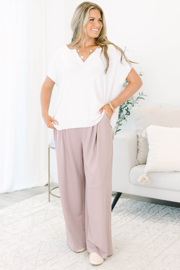 Plus size dusty rose wide-leg trousers with a flowy fit, pleated front, and belt loops.