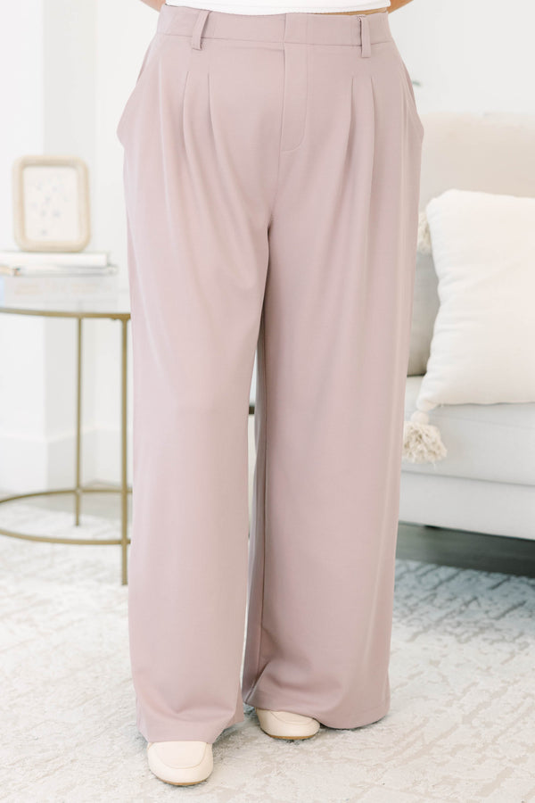 Plus size dusty rose wide-leg trousers with a flowy fit, pleated front, and belt loops.
