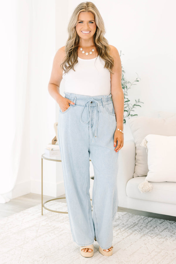 Plus Size light wash wide-leg jeans with an elastic drawstring waist and front pockets.