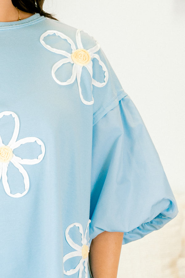 Plus Size light blue top with puff sleeves and three-dimensional white floral embroidery.