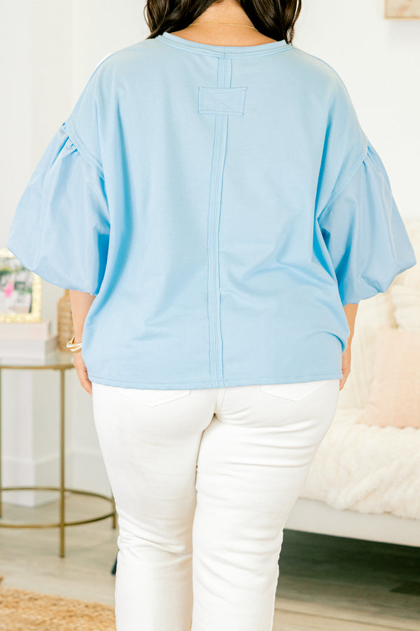 Plus Size light blue top with puff sleeves and three-dimensional white floral embroidery.