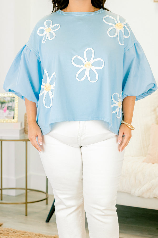 Plus Size light blue top with puff sleeves and three-dimensional white floral embroidery.
