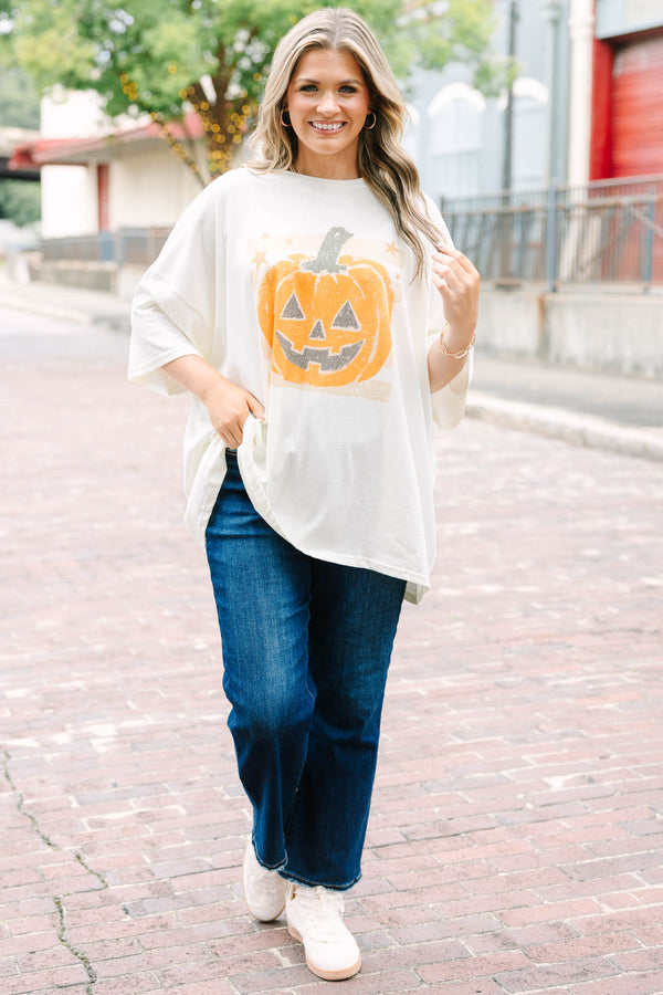 Ivory oversized boyfriend tee with a happy pumpkin graphic 