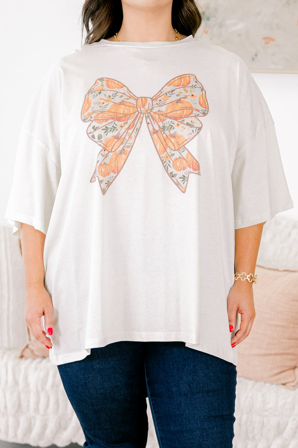 Chic Soul Plus size clothing, ivory graphic tee with a bow in the center of the shirt that is filled with a fall pumpkin pattern