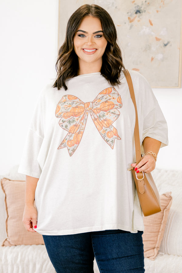 Chic Soul Plus size clothing, ivory graphic tee with a bow in the center of the shirt that is filled with a fall pumpkin pattern