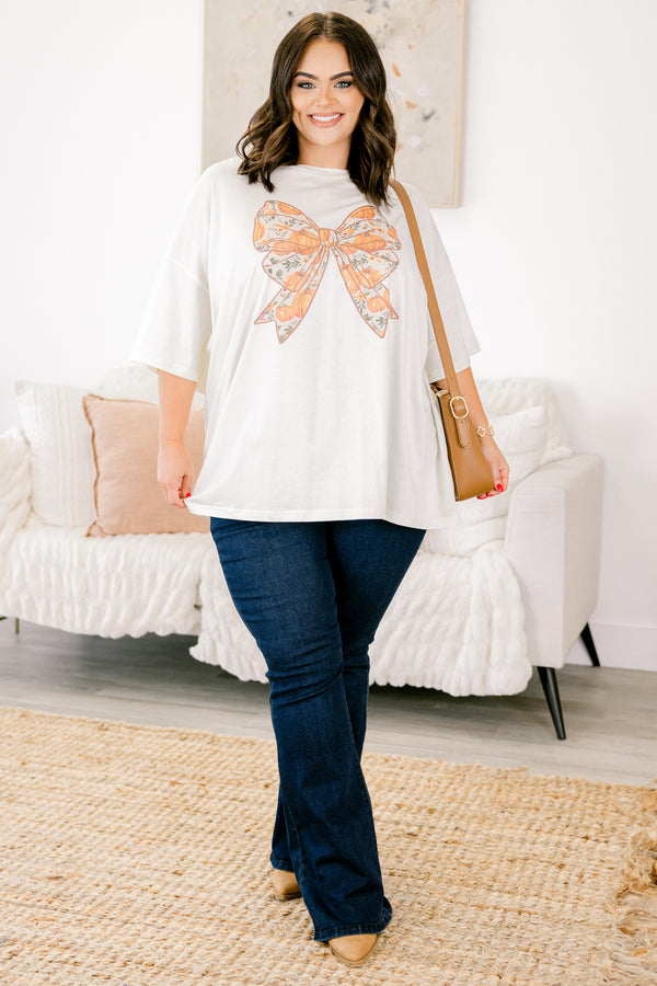 Chic Soul Plus size clothing, ivory graphic tee with a bow in the center of the shirt that is filled with a fall pumpkin pattern