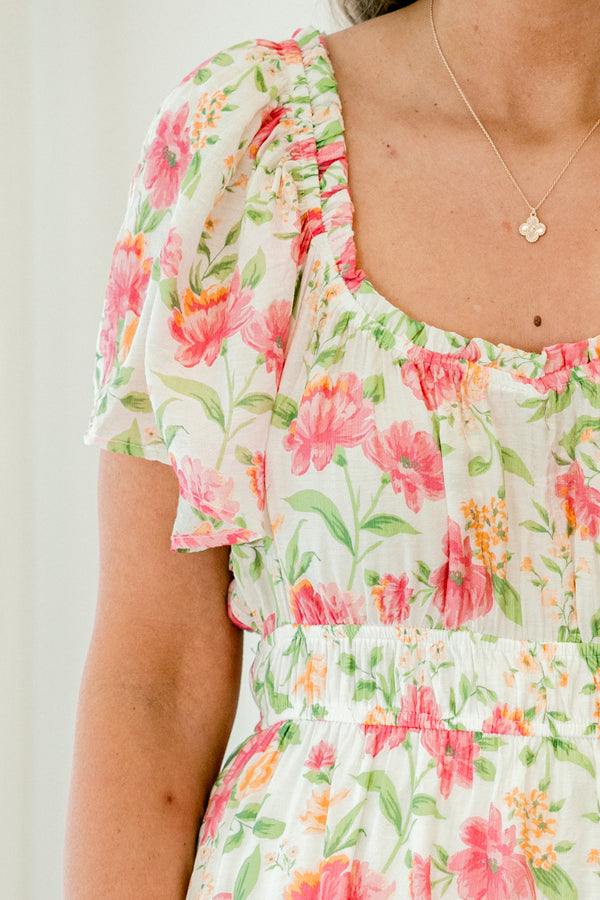 Chic Soul plus size clothing, pink short sleeve midi dress with short flutter sleeves with sweetheart neckline with cinched waist with ruffle detail long bottom with large pink floral pattern