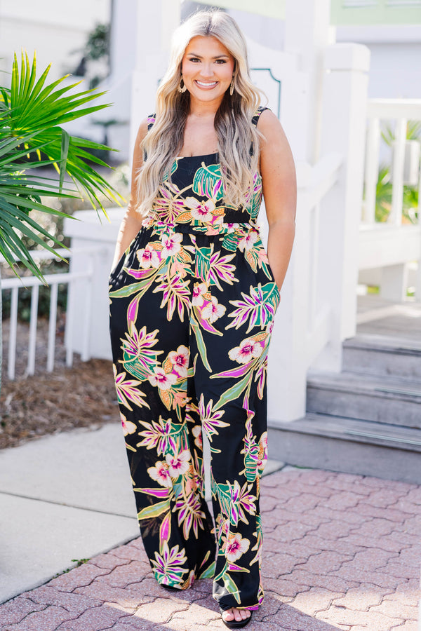 Chic Soul plus size clothing, black sleeveless jumpsuit with scoop neckline and synched waist with multicolor tropical print