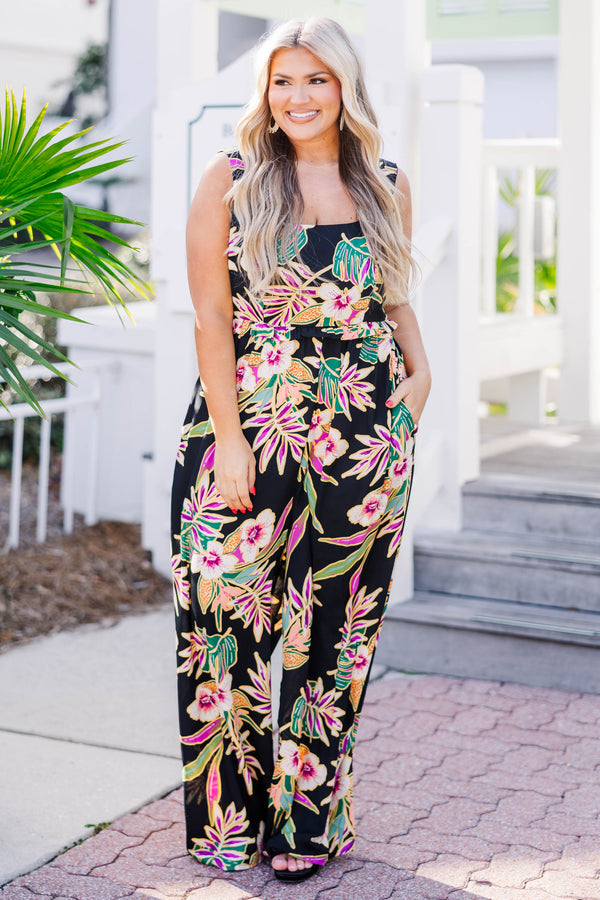 Chic Soul plus size clothing, black sleeveless jumpsuit with scoop neckline and synched waist with multicolor tropical print