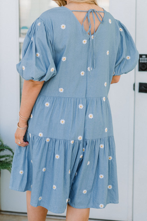 Chic Soul plus size clothing, short-puffed-sleeve denim blue ruffled baby doll top with a v-neckline and a subtle white daisy pattern 