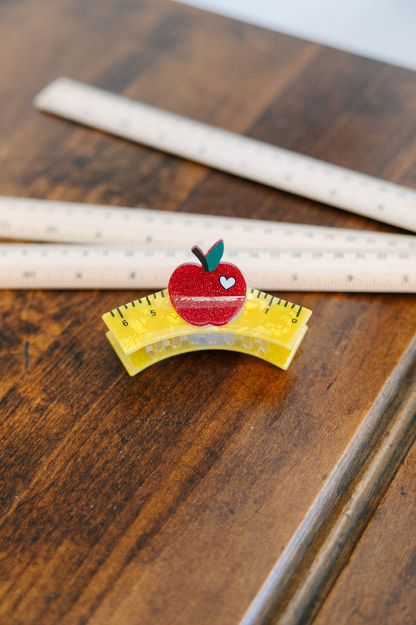 Plus Size yellow ruler-shaped hair clip with a red glitter apple and white heart detail.