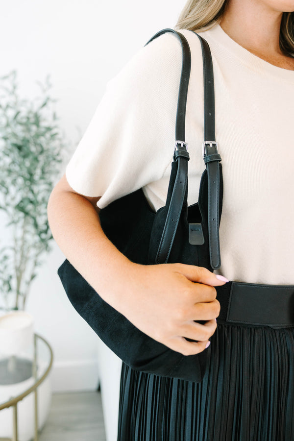 Plus Size black suede shoulder bag with adjustable straps and a spacious, slouchy silhouette.