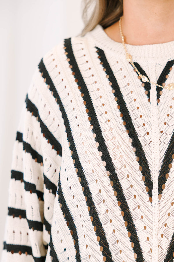 Plus Size cream and black chevron striped pointelle knit sweater with long sleeves and crew neck.