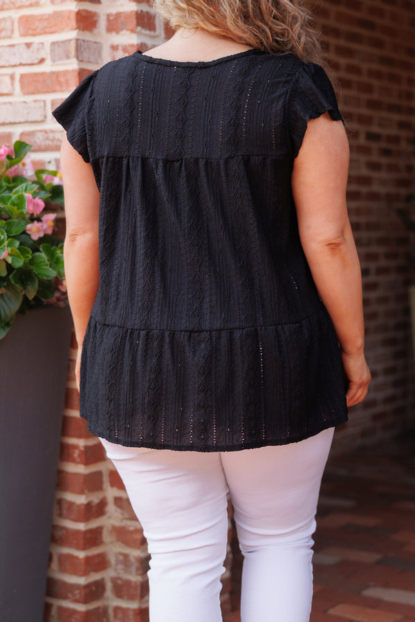 Chic Soul plus size clothing, black textured short sleeves top with ruffle hemline and a v neck