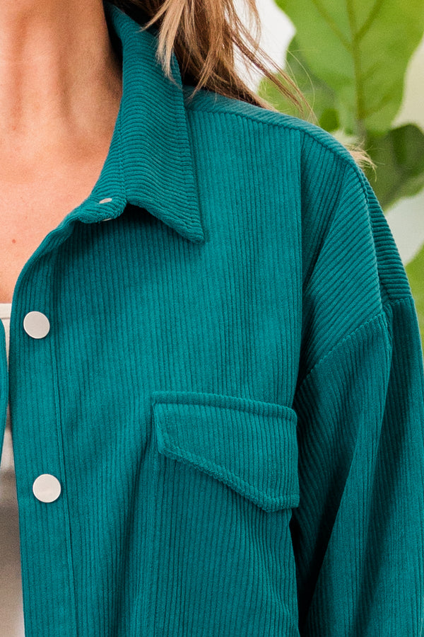 Plus Size teal corduroy button-down jacket with chest pockets over a white top and light wash jeans.
