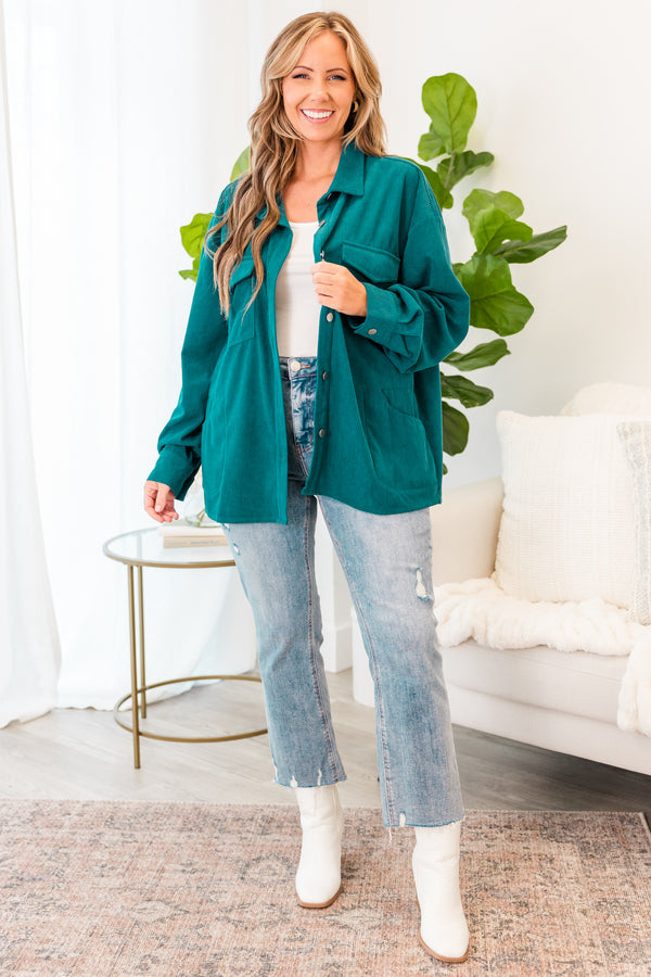 Plus Size teal corduroy button-down jacket with chest pockets over a white top and light wash jeans.