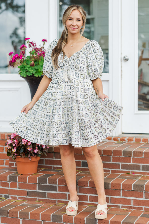 Chic Soul plus size clothing, sage short sleeve mini dress with geometric pattern with puff sleeves and v neckline with tassel tie detail 