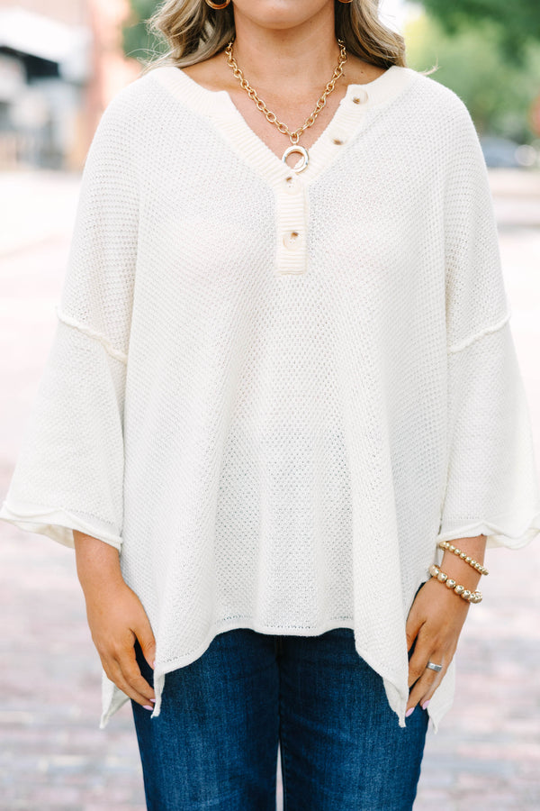 Plus Size cream knitted henley top with a relaxed fit, long sleeves, and button-down neckline.