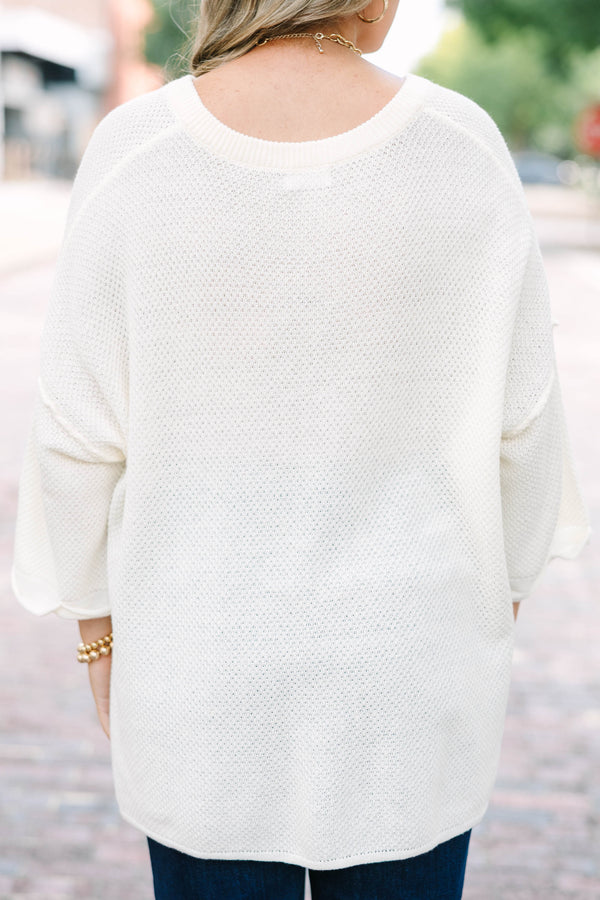 Plus Size cream knitted henley top with a relaxed fit, long sleeves, and button-down neckline.