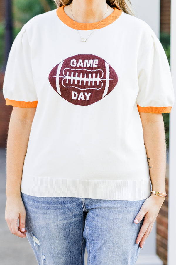 Chic Soul plus size clothing, white short sleeve knit top with orange trim along round neckline and puff sleeves with brown football graphic with 