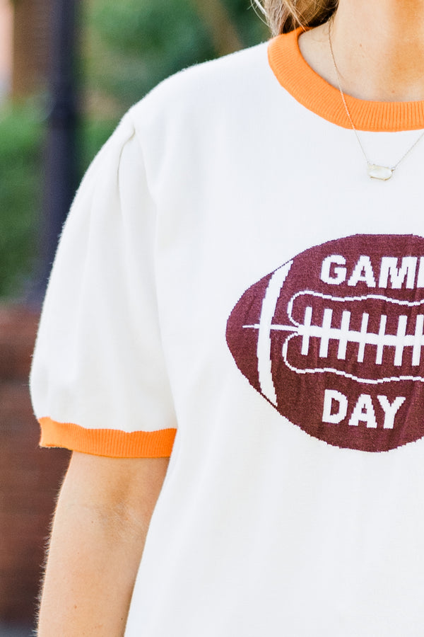 Chic Soul plus size clothing, white short sleeve knit top with orange trim along round neckline and puff sleeves with brown football graphic with 