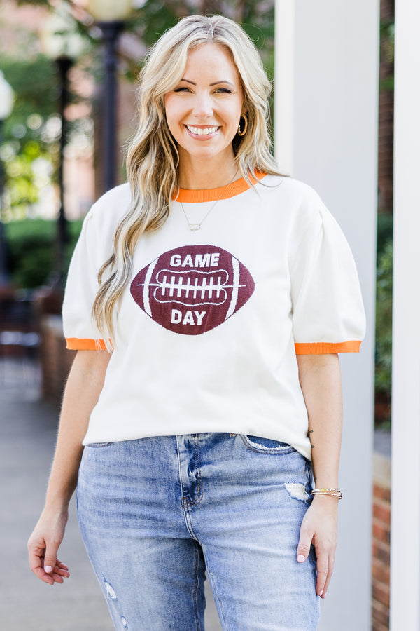 Chic Soul plus size clothing, white short sleeve knit top with orange trim along round neckline and puff sleeves with brown football graphic with 