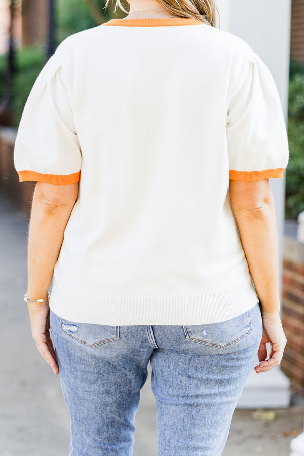 Chic Soul plus size clothing, white short sleeve knit top with orange trim along round neckline and puff sleeves with brown football graphic with 