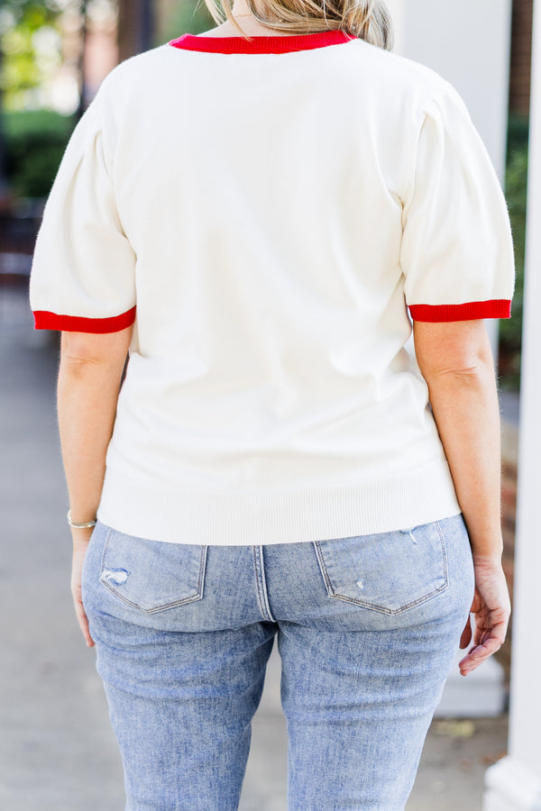 Chic Soul plus size clothing, white short sleeve knit top with red trim along round neckline and puff sleeves with brown football graphic with 