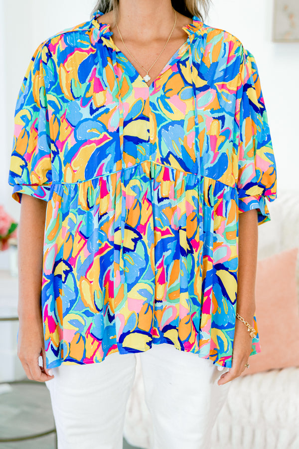 Chic Soul plus size clothing, short sleeve blue babydoll top with yellow and pink abstract pattern