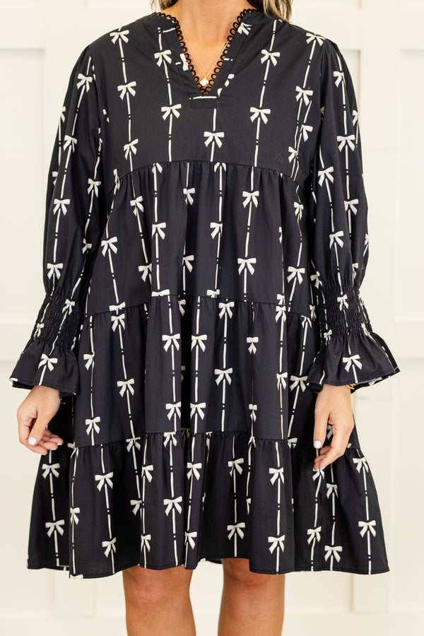 Chic Soul plus size clothing, long-sleeve black ruffled baby doll dress with a v-neckline and scalloped detailing along neckline with a pinstripe white bow pattern