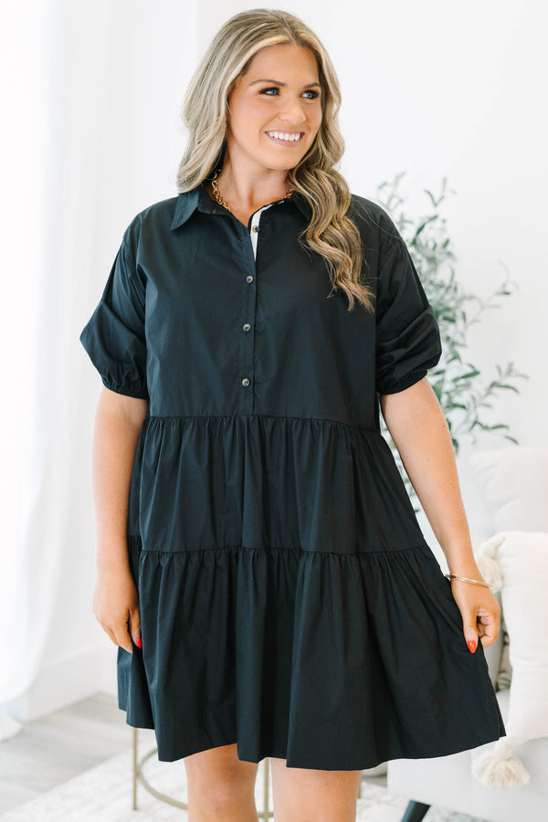 Plus Size black cotton tiered shirt dress with short puff sleeves and a button-down front.