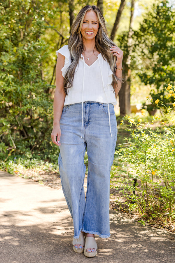 chic soul plus size clothing, Light wash jeans with front pockets and a fringed detail at the end of the pant leg 