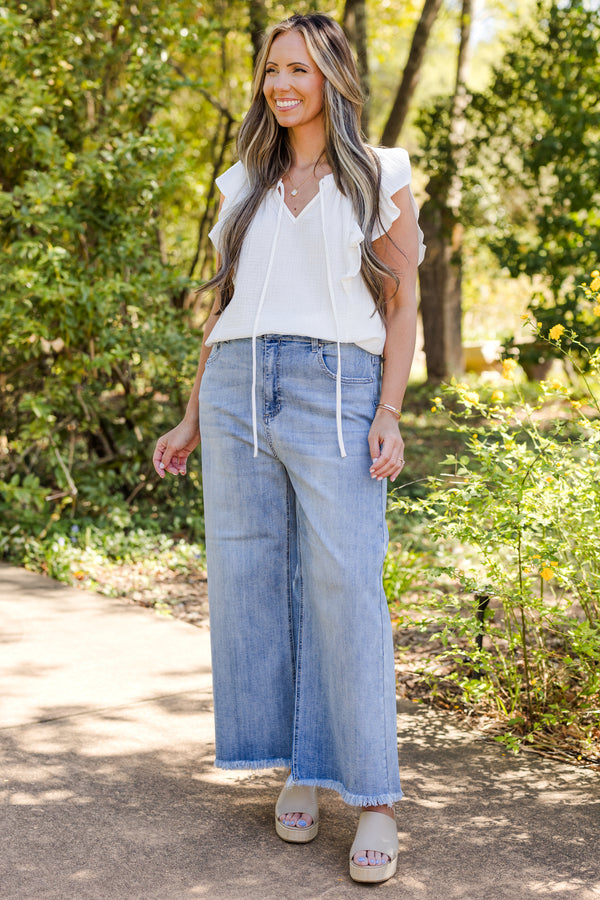 chic soul plus size clothing, Light wash jeans with front pockets and a fringed detail at the end of the pant leg 