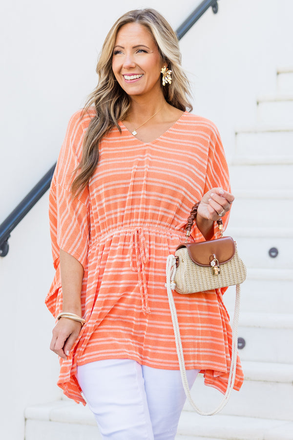 Chic Soul plus size clothing, orange short sleeve poncho top with cinched waist with tie detail with v neckline and flowy sleeves with white striped pattern
