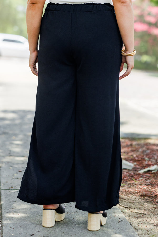 Chic Soul plus size clothing, black flowy pants with ruched stretchy waist and pockets plus small slit along calf
