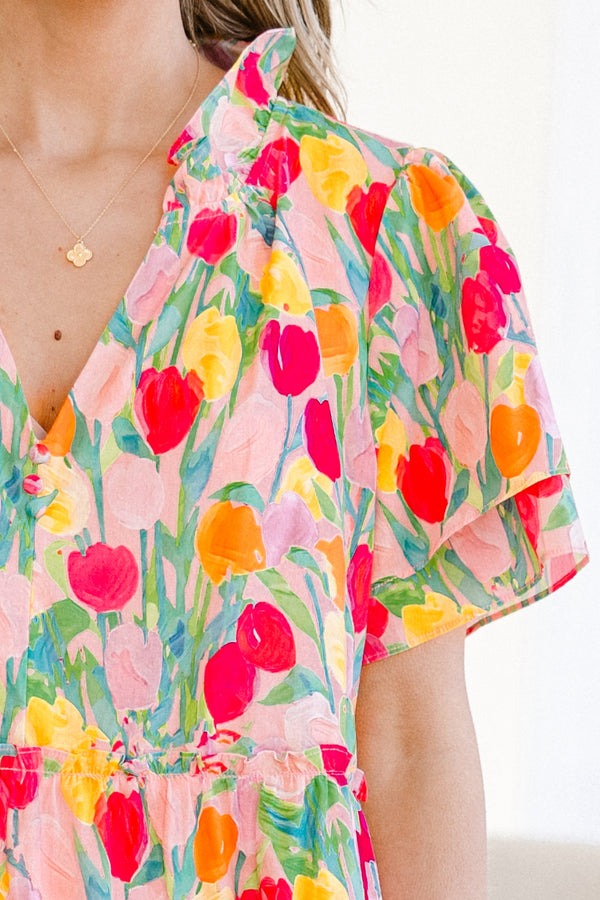 Plus Size pink v-neck dress with a colorful tulip print and layered flutter sleeves.