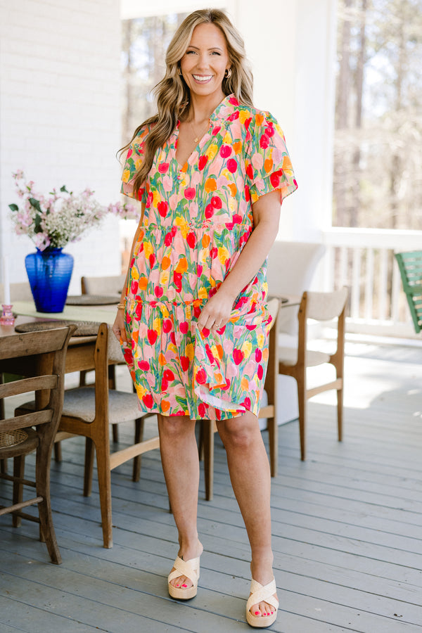 Plus Size pink v-neck dress with a colorful tulip print and layered flutter sleeves.