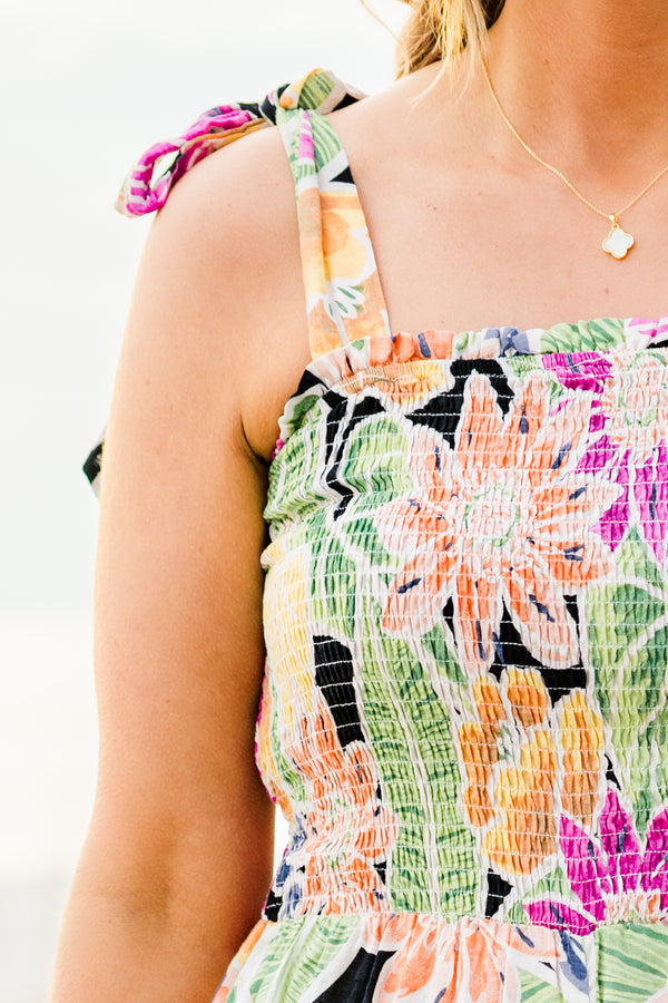 Chic Soul plus size clothing, black sleeveless flowy jumpsuit with a smocked bodice and tied straps with a multi-colored floral pattern