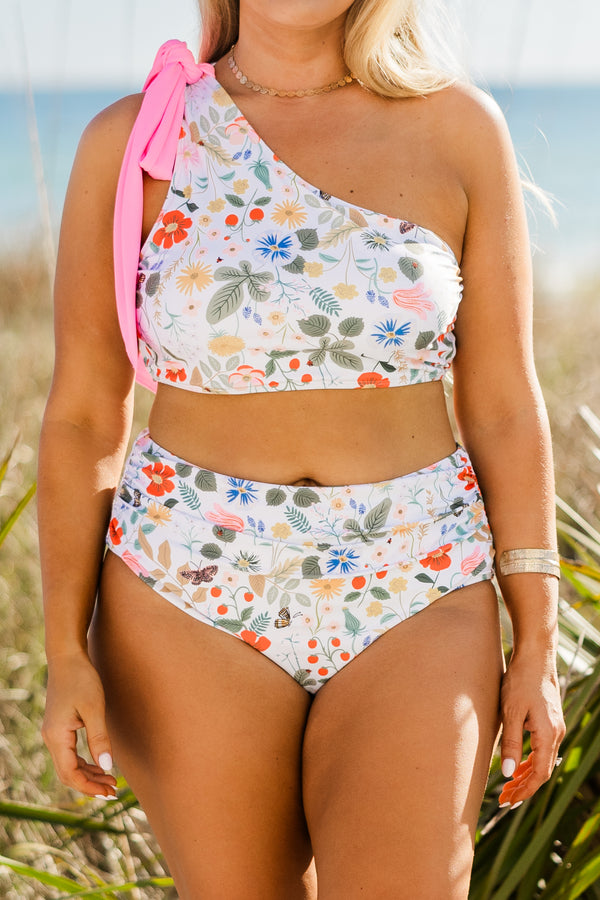 Plus Size one-shoulder floral swim top with a pink tie strap and matching high-waisted bottoms.