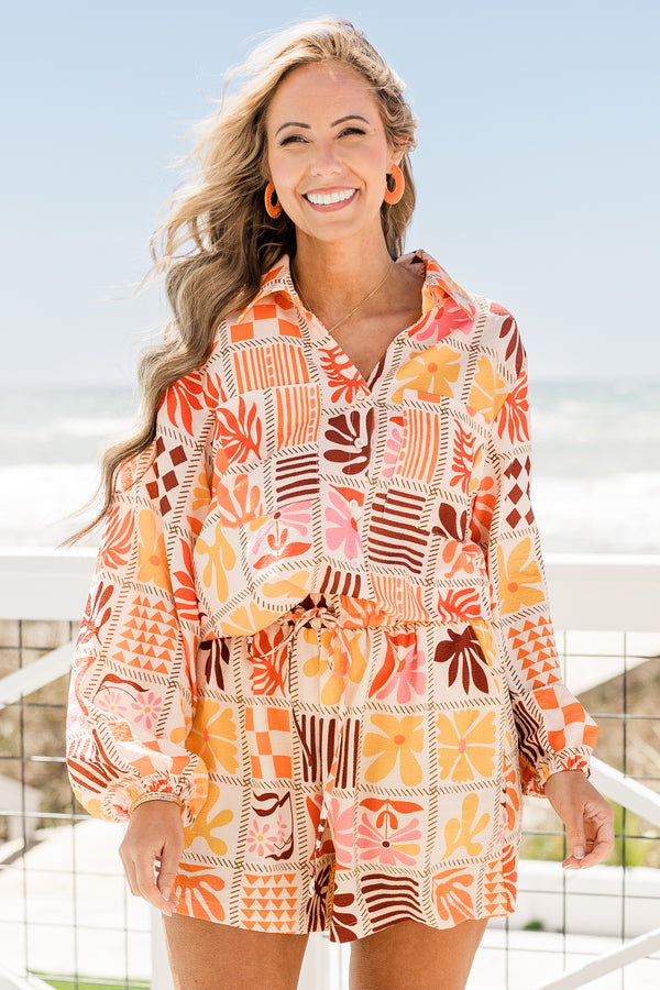 Chic Soul plus size clothing, elastic waistband orange multi-colored flowy shorts with a geometric floral pattern 