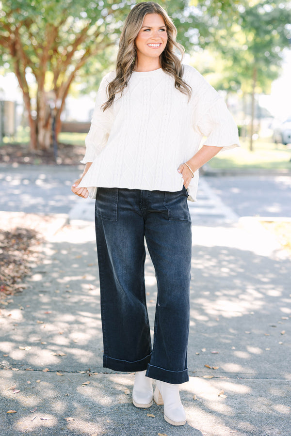 Plus Size black wide-leg jeggings with front patch pockets and cuffed hems.