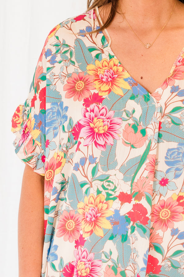 Chic Soul plus size clothing, short sleeve v-neckline cream mixed colored top with pink, blue, and yellow floral details