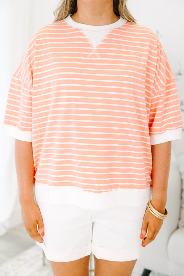 Plus Size coral and white striped short sleeve top with a crew neck and ribbed trim.