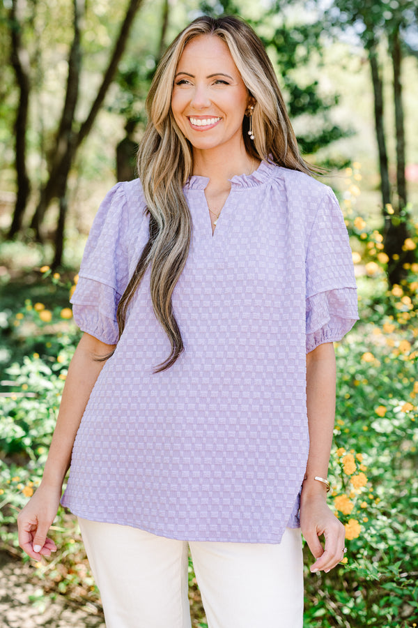 Chic Soul plus size clothing, short-puffed-sleeve light purple top with a textured spotted material and a split-v-neckline with ruffles along the neckline