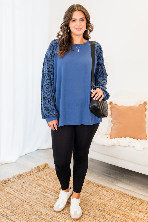 Chic Soul plus size clothing, blue long sleeve flowy top with round neckline with black dotted sleeves with cuff detail on sleeves