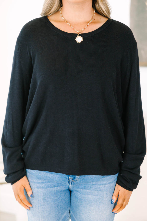 Plus Size black long sleeve sweater with a crew neckline and relaxed fit in a soft knit fabric.