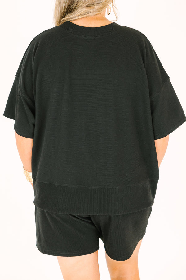 Plus Size black two-piece set featuring a short-sleeve ribbed top and matching pull-on shorts.