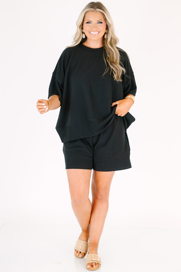 Plus Size black two-piece set featuring a short-sleeve ribbed top and matching pull-on shorts.