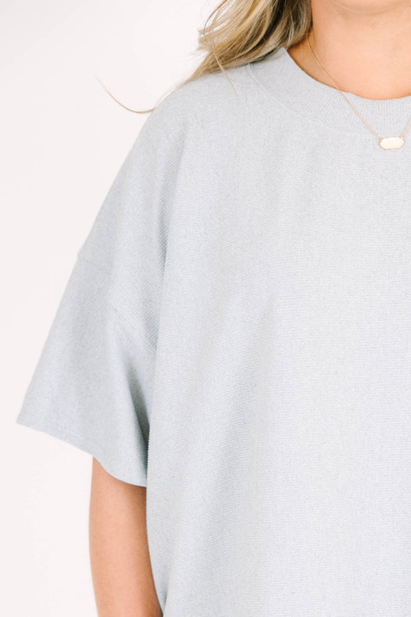 Plus Size sage green two-piece set with a short-sleeve ribbed top and matching pull-on shorts.