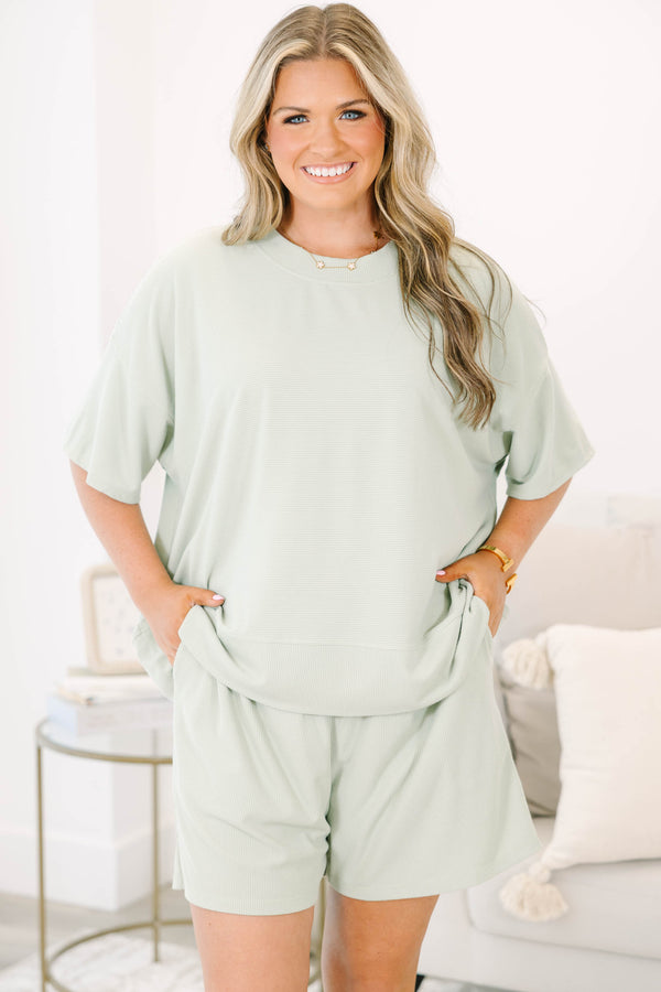 Plus Size sage green two-piece set with a short-sleeve ribbed top and matching pull-on shorts.